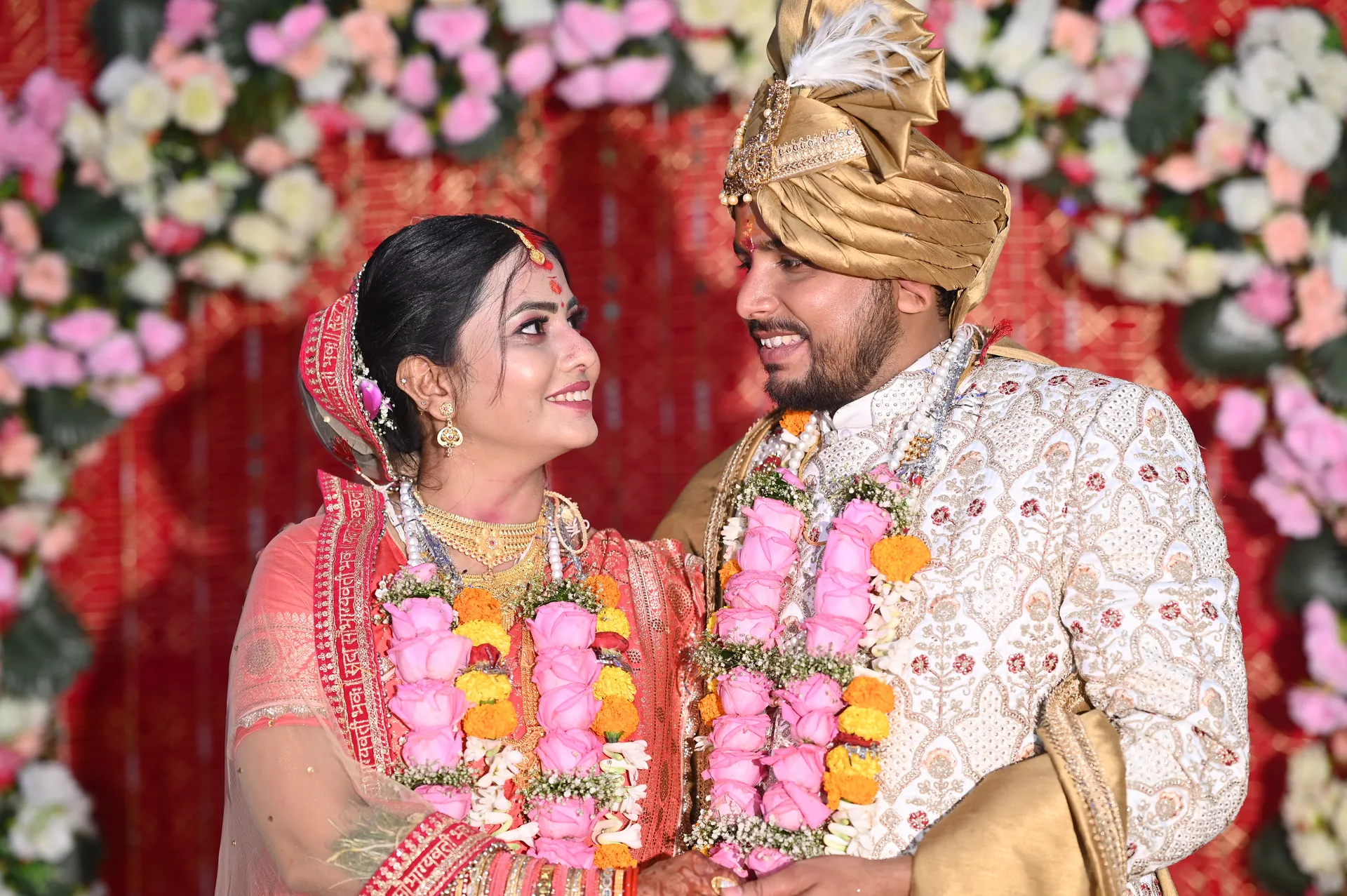 Luxury Wedding Couple Portrait with floral décor and traditional attire